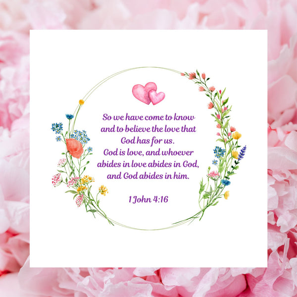 A beautiful white square card pictured against a background of pink rose petals. The design of this Mary, Martha & Meg card has a lovely floral wreath framing the Bible verse, “So we have come to know and to believe the love that God has for us. God is love, and whoever abides in love abides in God, and God abides in Him.” 1 John 4:16. Above the Bible verse are two pink intertwined hearts. This beautiful card is ideal for celebrating an engagement, wedding or anniversary.