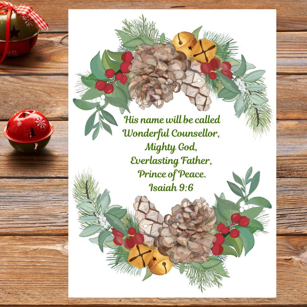 A beautiful Mary, Martha & Meg Christian Christmas Greeting card with the treasured Bible verse, "His name will be called Wonderful Counsellor, Mighty God, Everlasting Father, Prince of Peace." Isaiah 9:6 This is framed by a wreath of pine cones, golden Christmas bells, foliage and red berries. The card is pictured on brown wood with two Christmas baubles to the left.