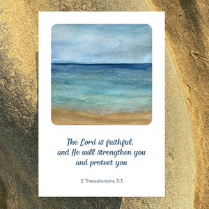 A beautiful greetings card of a calming seashore, printed from an original watercolour by Meg, showing blue waves flowing onto a sandy beach. The scripture text reads, “The Lord is faithful, and He will strengthen you and protect you.” 2 Thessalonians 3:3. A perfect card for those who need uplifting, whether suffering from health or work issues, or needing reassurance of God’s promises. The card is photographed on golden sand.