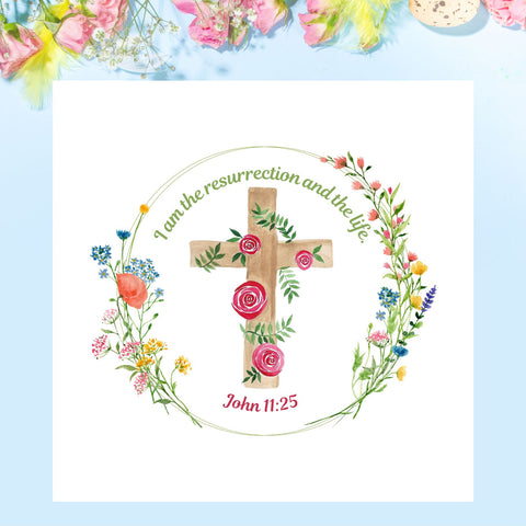 This design of this Mary, Martha & Meg Easter card features a delicate floral wreath. In the centre of this pretty wreath is a cross intertwined with roses and green leaves. The green text above the cross reads, ‘I am the resurrection and the life.’ Underneath the cross is the Bible reference, John 11:25. This square, white Easter card is photographed on a sky-blue background with pink and yellow flowers above it. A beautiful card to share the joy of Easter with others.