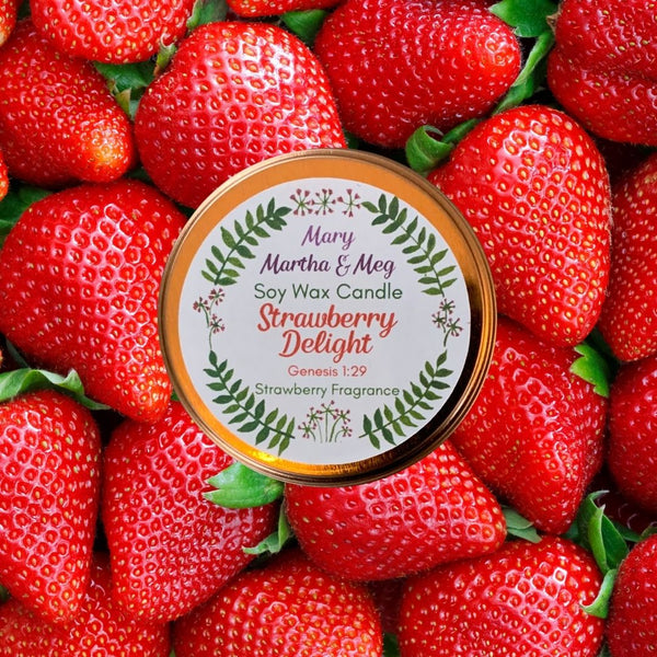 Strawberry Delight Candle Tin Lid on a background of bright freshly picked strawberries.